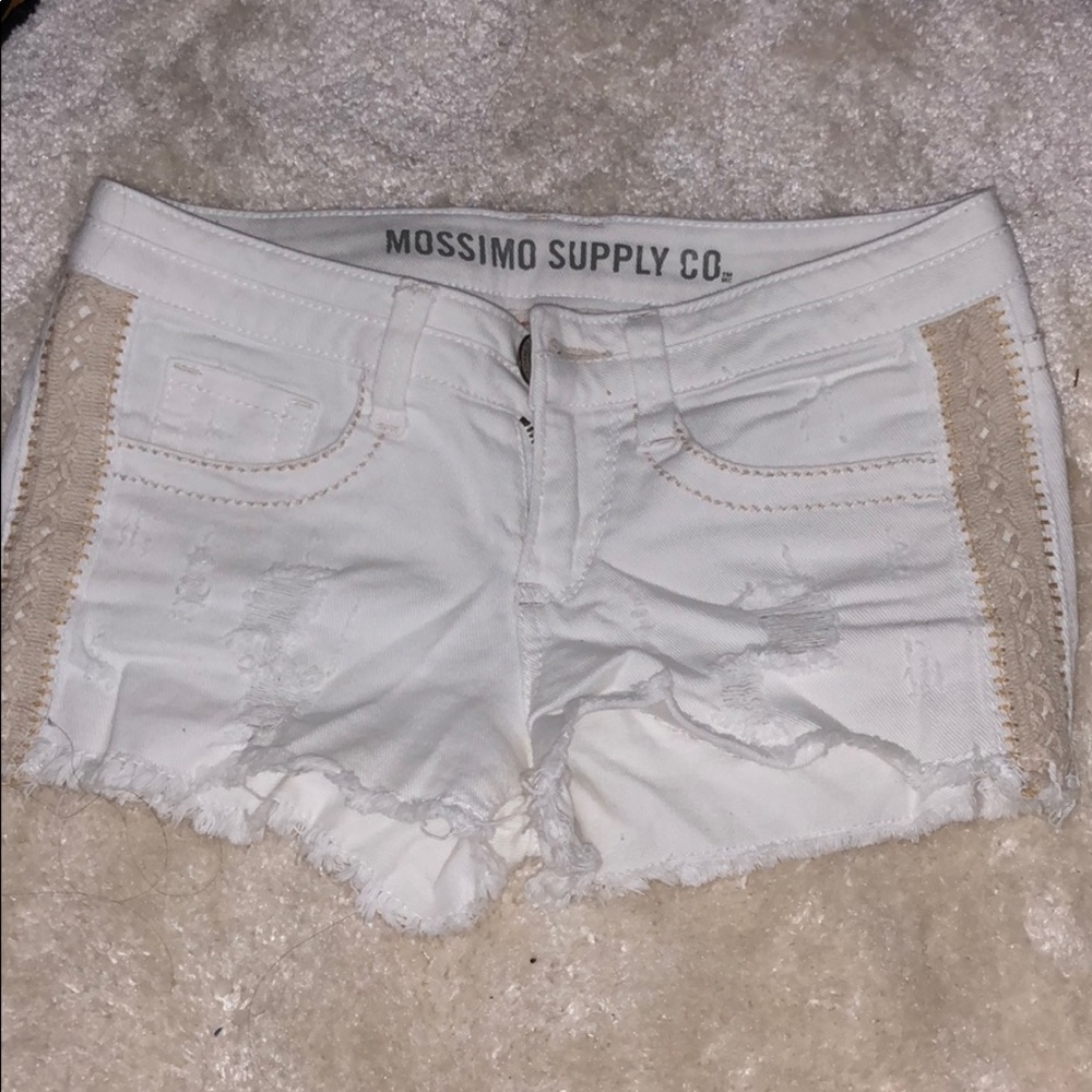 Distressed white jean shorts with lace